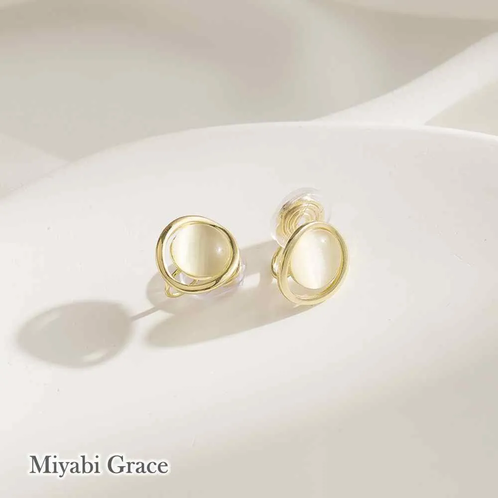 Round Beige Gold Dome Crystal Coil Clip On Earrings